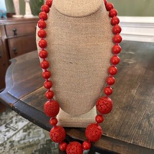 26 inch red beaded necklace! Substantial weight